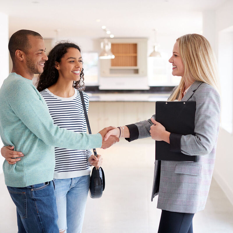 Valuation manager shaking hands with property owners